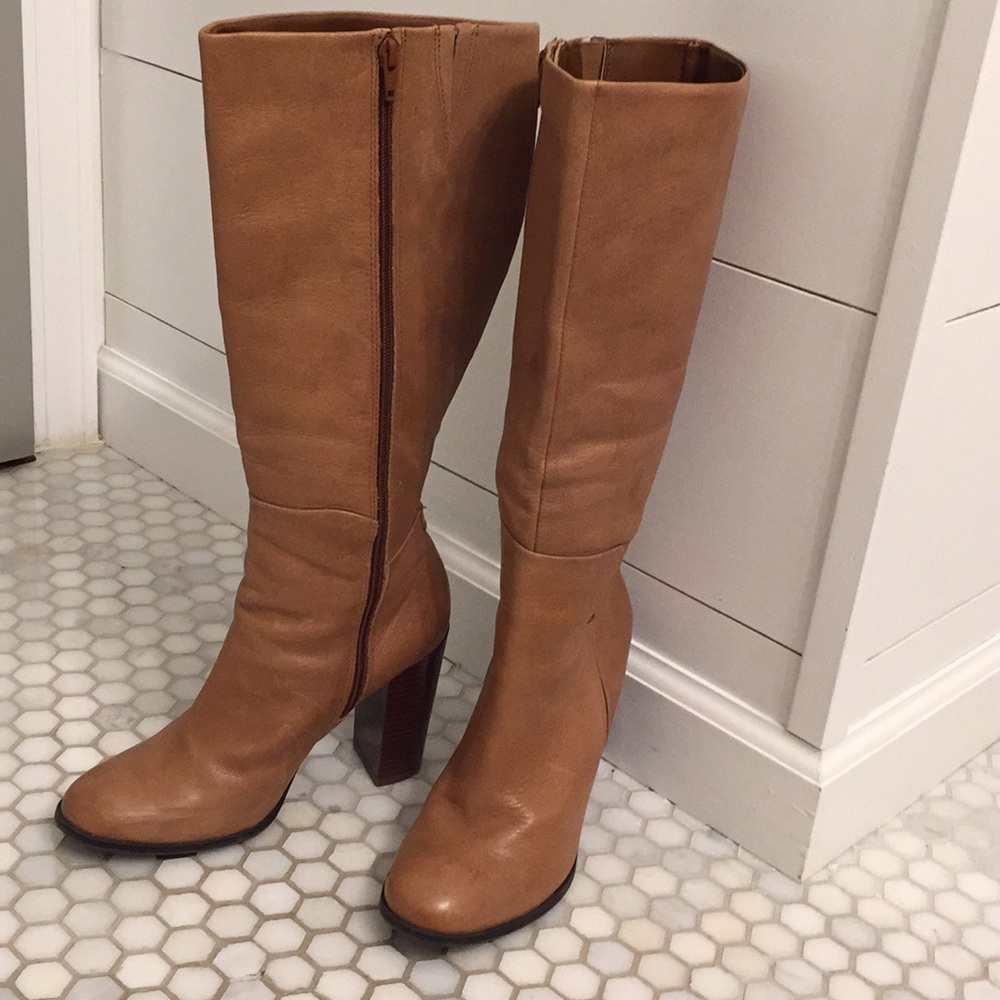 High heeled boots fit right below knee.  4” heel